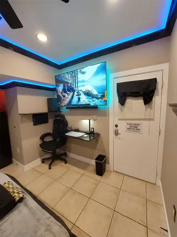 a living room with a couch and a flat screen tv