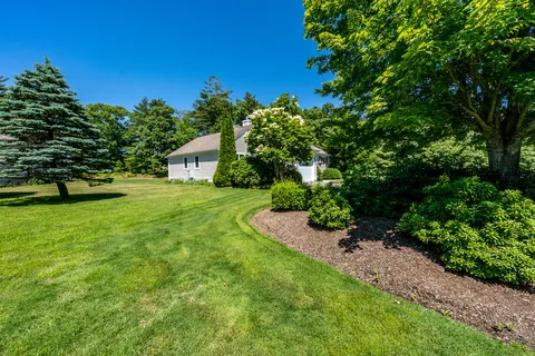 a front view of a house with a yard