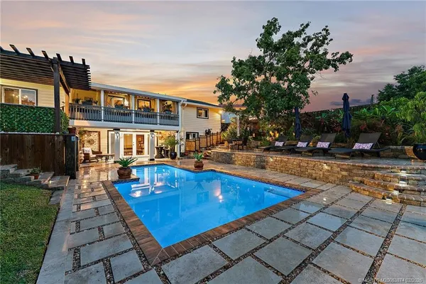 a view of a patio with swimming pool