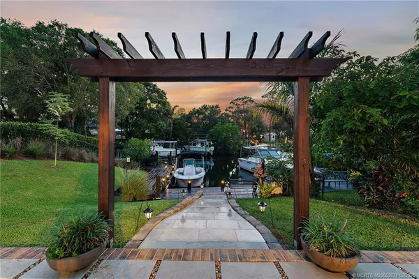 a view of a backyard with sitting area