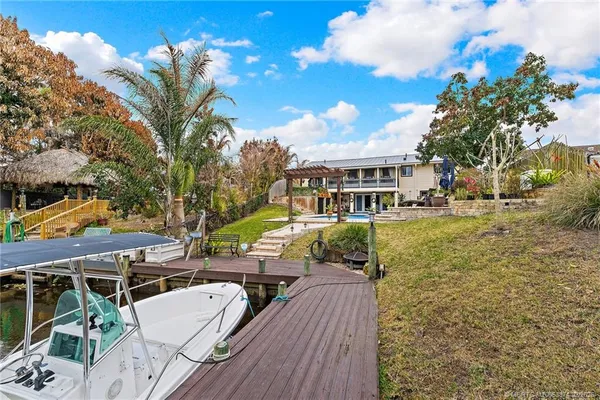 a view of a porch with wooden floor and windows