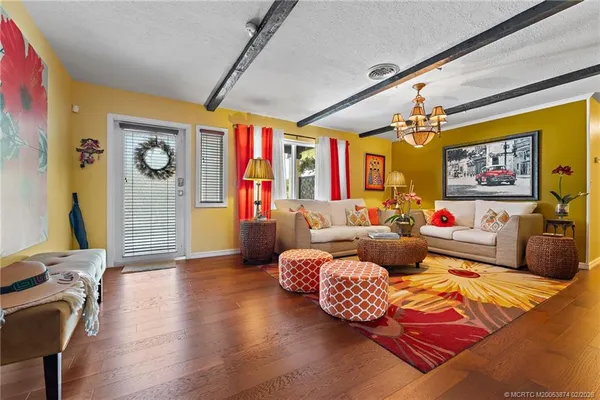 a kitchen with a stove a sink and a microwave