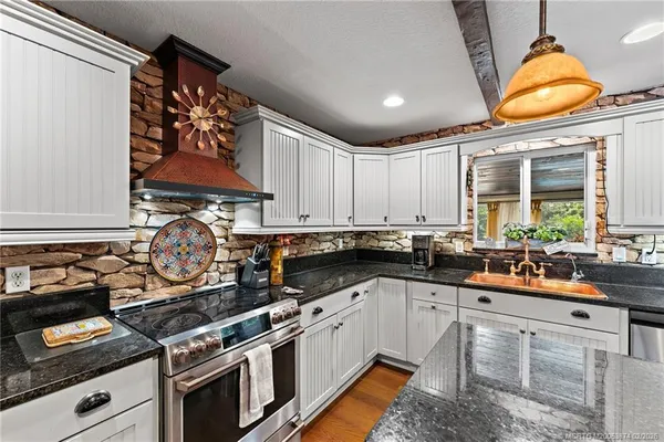 a bedroom with a bed and balcony with furniture