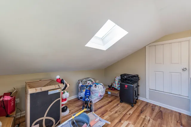 a large white kitchen with sink and dishwasher
