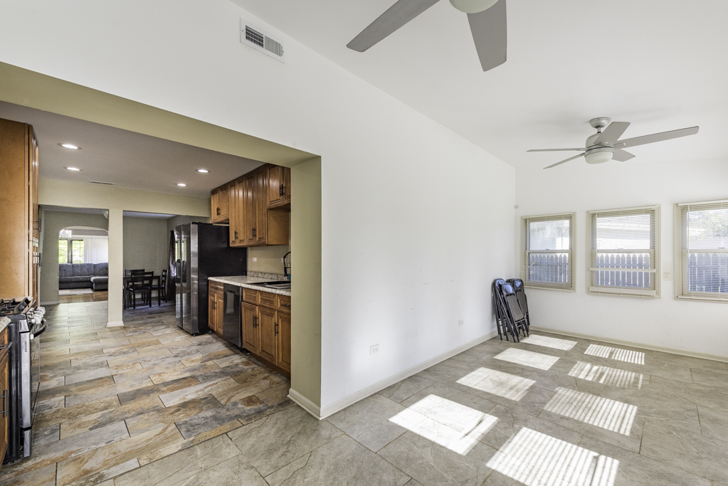 1700 Gideon Avenue Zion, IL 60099 - Photo 19 of 33 a large white kitchen with sink and dishwasher