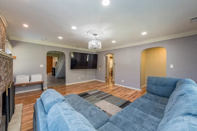 a living room with a couch and a fireplace