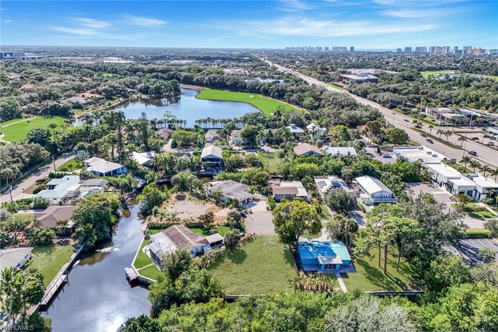 59 River Court Naples, FL 34110 - Photo 2 of 7 an aerial view of residential house with outdoor space