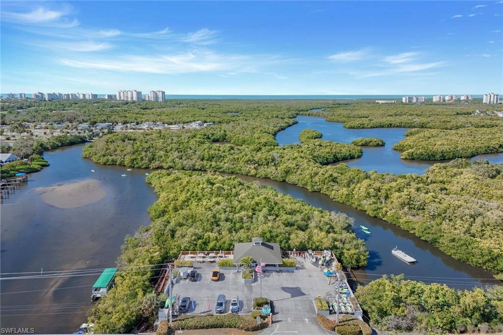 59 River Court Naples, FL 34110 - Photo 4 of 7 a view of a city and ocean view