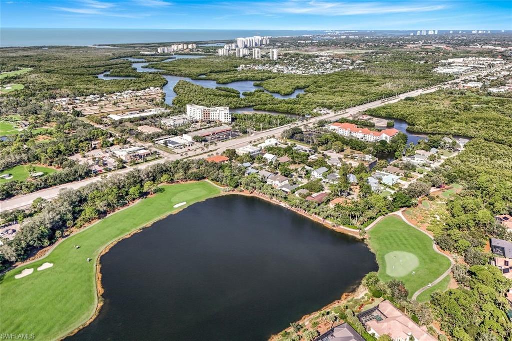 59 River Court Naples, FL 34110 - Photo 5 of 7 an aerial view of a houses with a lake view