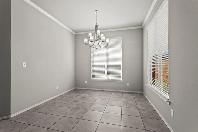 a view of an empty room with a ceiling fan