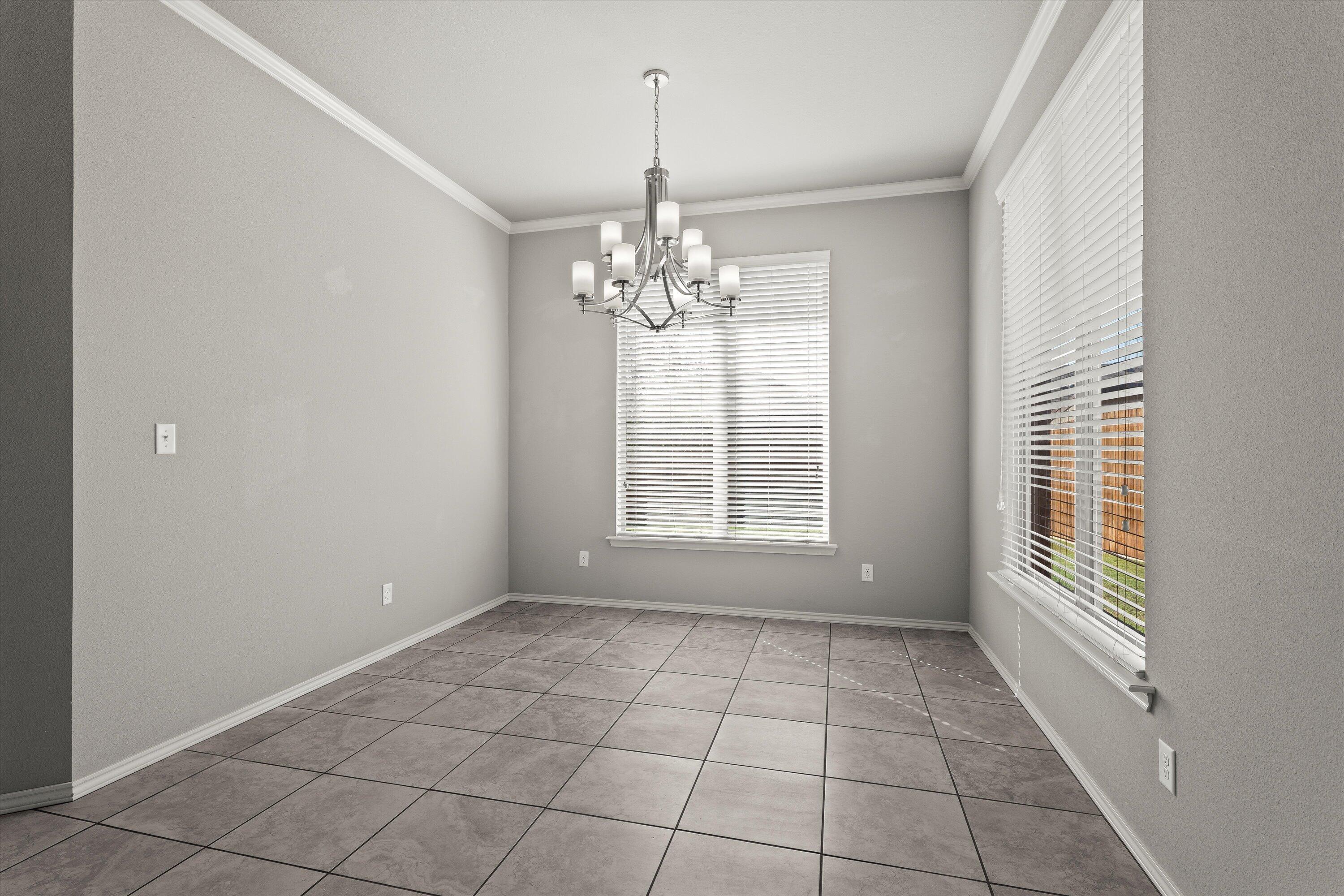9616 Kline Avenue Lubbock, TX 79424 - Photo 14 of 33 a view of an empty room with a window