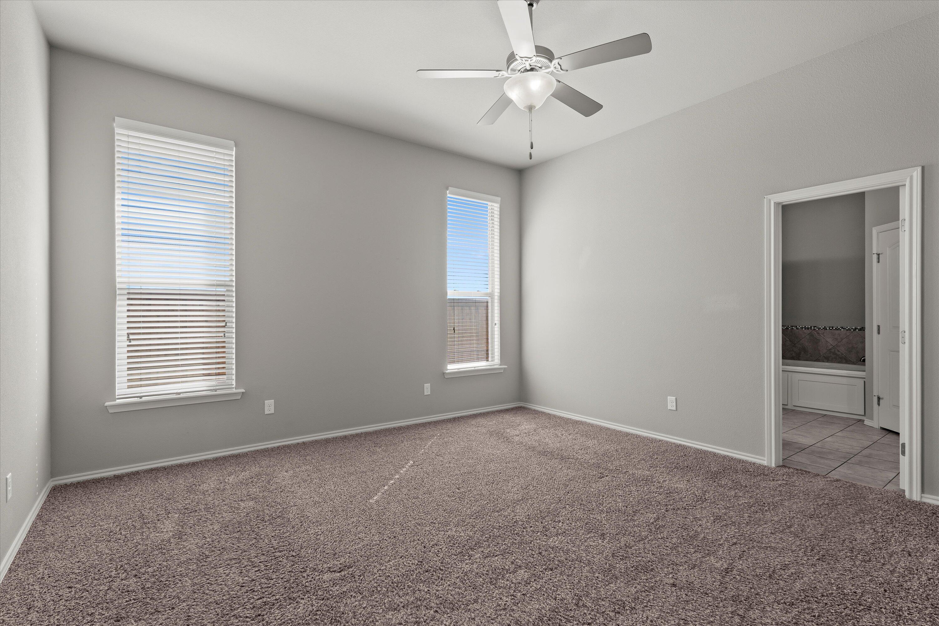 9616 Kline Avenue Lubbock, TX 79424 - Photo 15 of 33 a view of an empty room with a window
