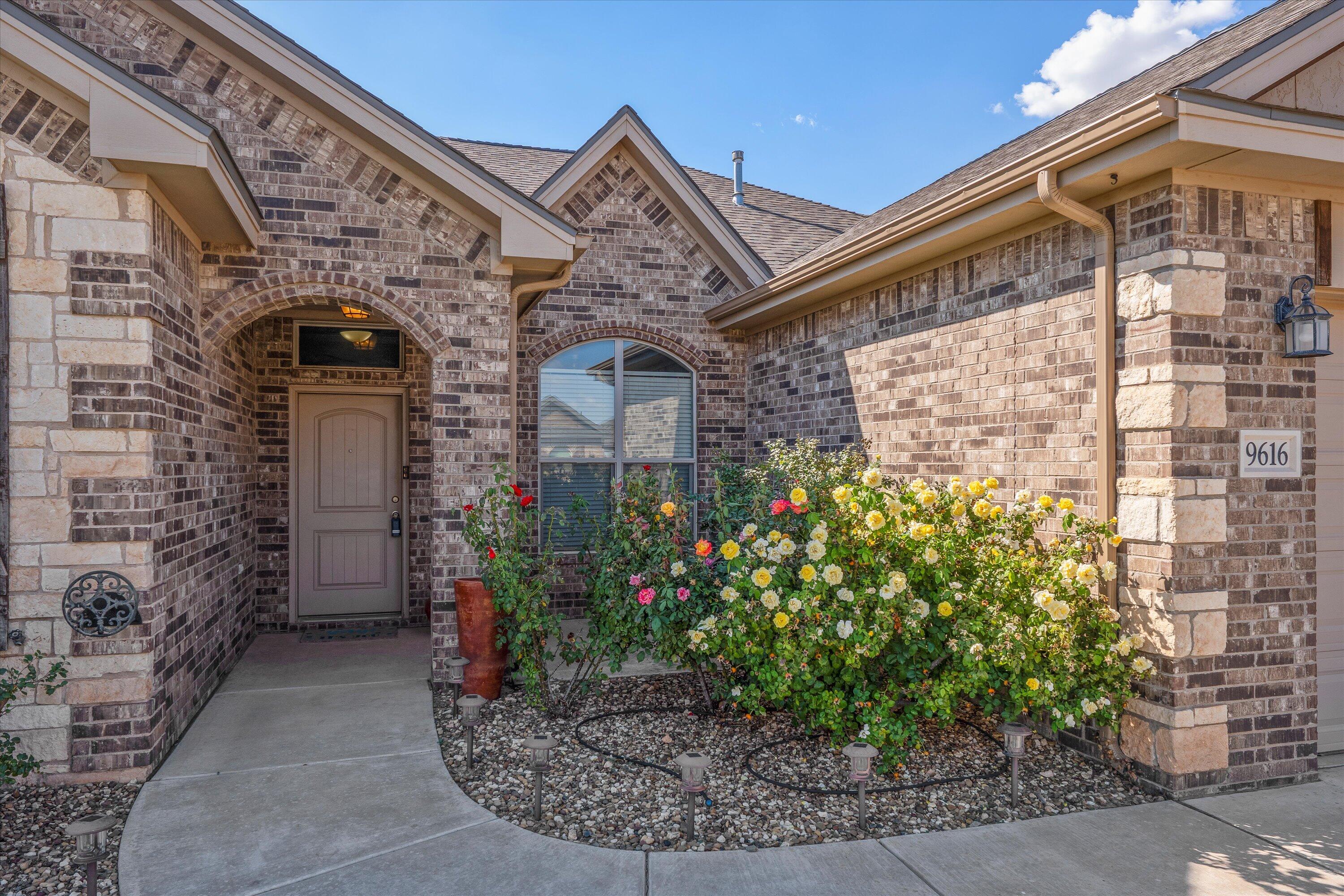 9616 Kline Avenue Lubbock, TX 79424 - Photo 2 of 33 a front view of a house
