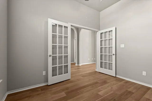 a view of a kitchen with furniture and wooden floor