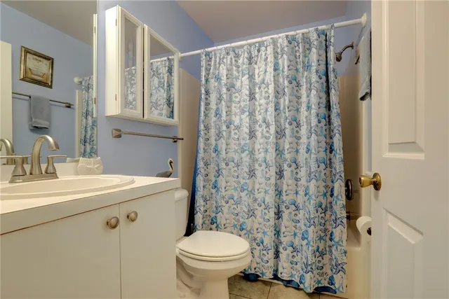 a outdoor living space with furniture and a rug