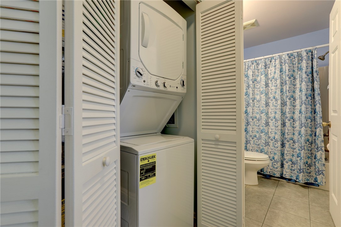 9635 Riverside Drive, Unit 4 Sebastian, FL 32958 - Photo 21 of 34 a utility room with dryer and washer