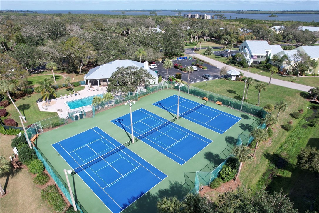 9635 Riverside Drive, Unit 4 Sebastian, FL 32958 - Photo 24 of 34 an aerial view of a tennis ground with a mountain view