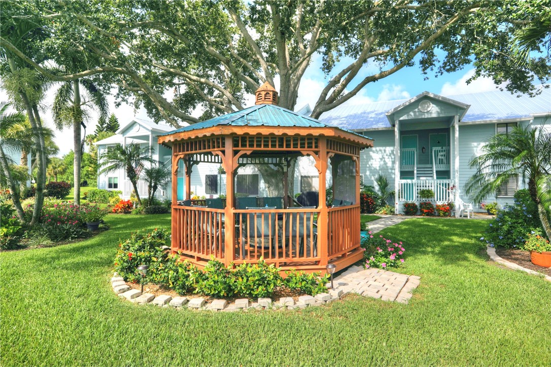 9635 Riverside Drive, Unit 4 Sebastian, FL 32958 - Photo 25 of 34 a front view of a house with garden