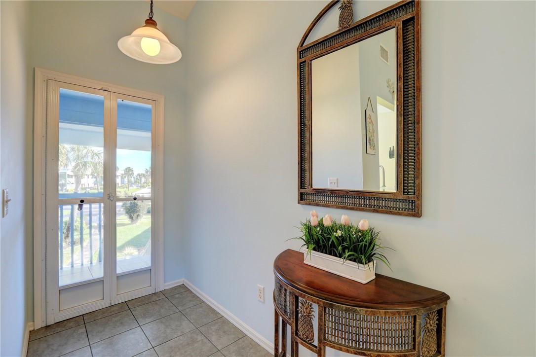 9635 Riverside Drive, Unit 4 Sebastian, FL 32958 - Photo 7 of 34 a view of an entryway with wooden floor and door