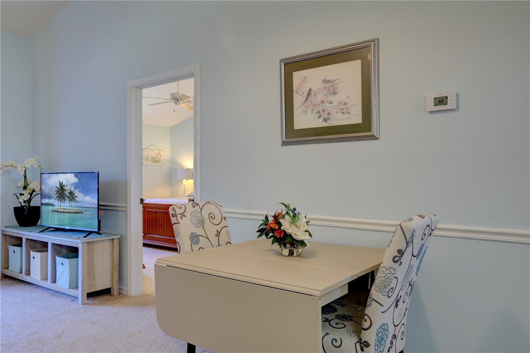 9635 Riverside Drive, Unit 4 Sebastian, FL 32958 - Photo 9 of 34 a living room with furniture and a table