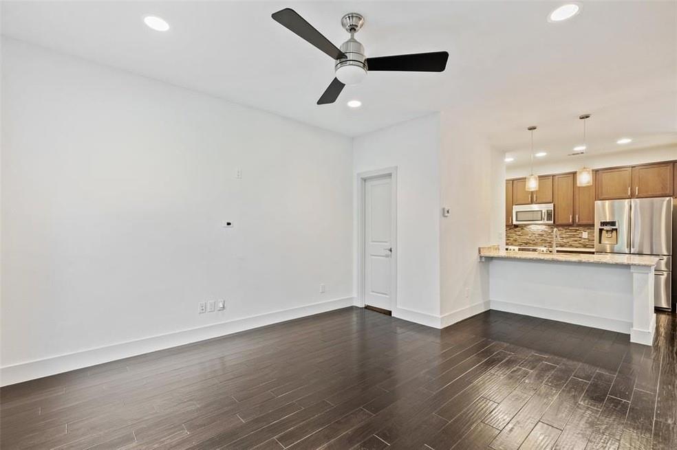 5924 Hudson Street, Unit F Dallas, TX 75206 - Photo 6 of 25 a view of kitchen with wooden floor and window