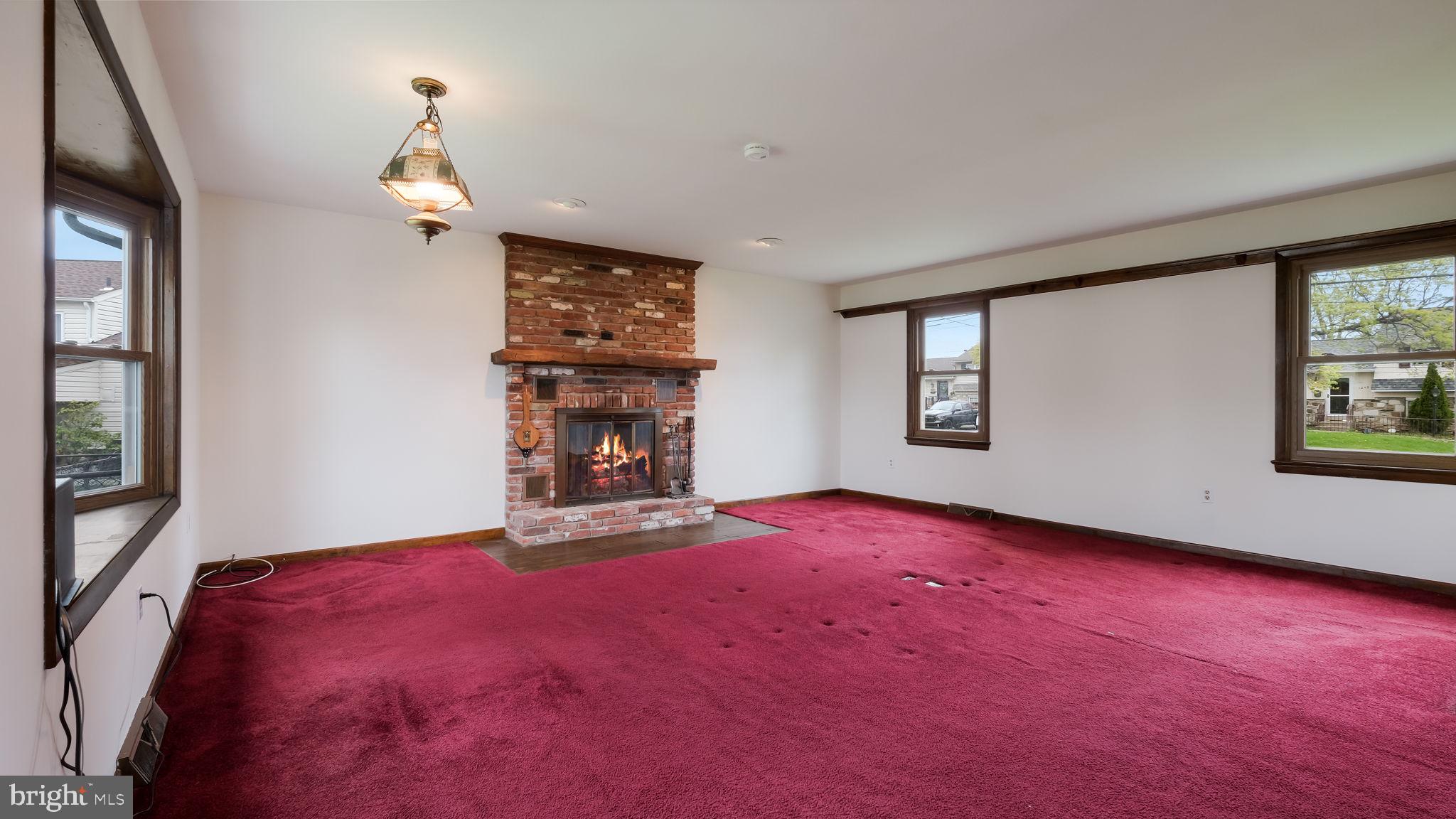 1243 Tulip Road Warminster, PA 18974 - Photo 17 of 33 an empty room with windows and fireplace