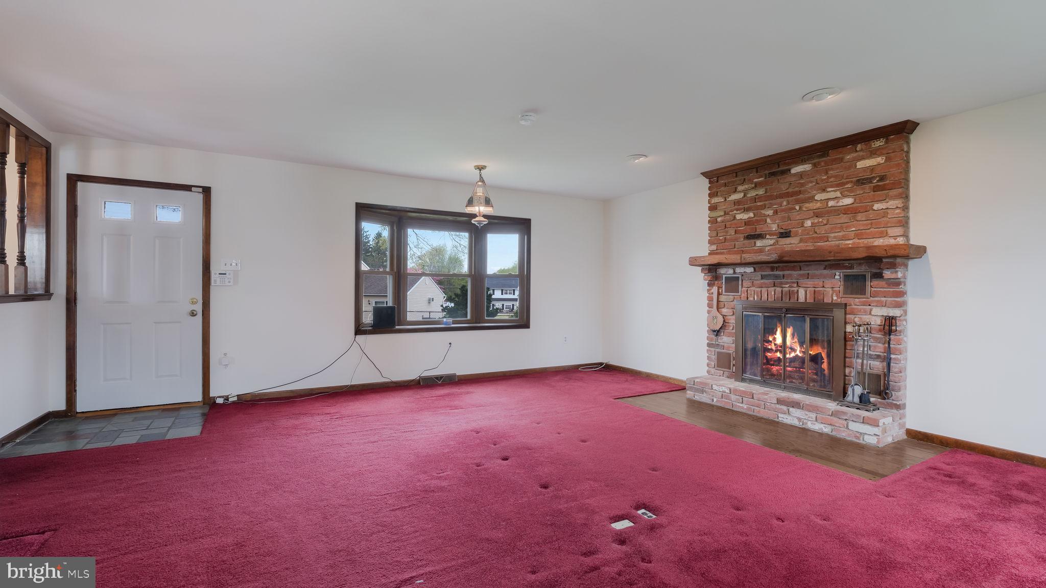 1243 Tulip Road Warminster, PA 18974 - Photo 19 of 33 an empty room with fireplace and windows