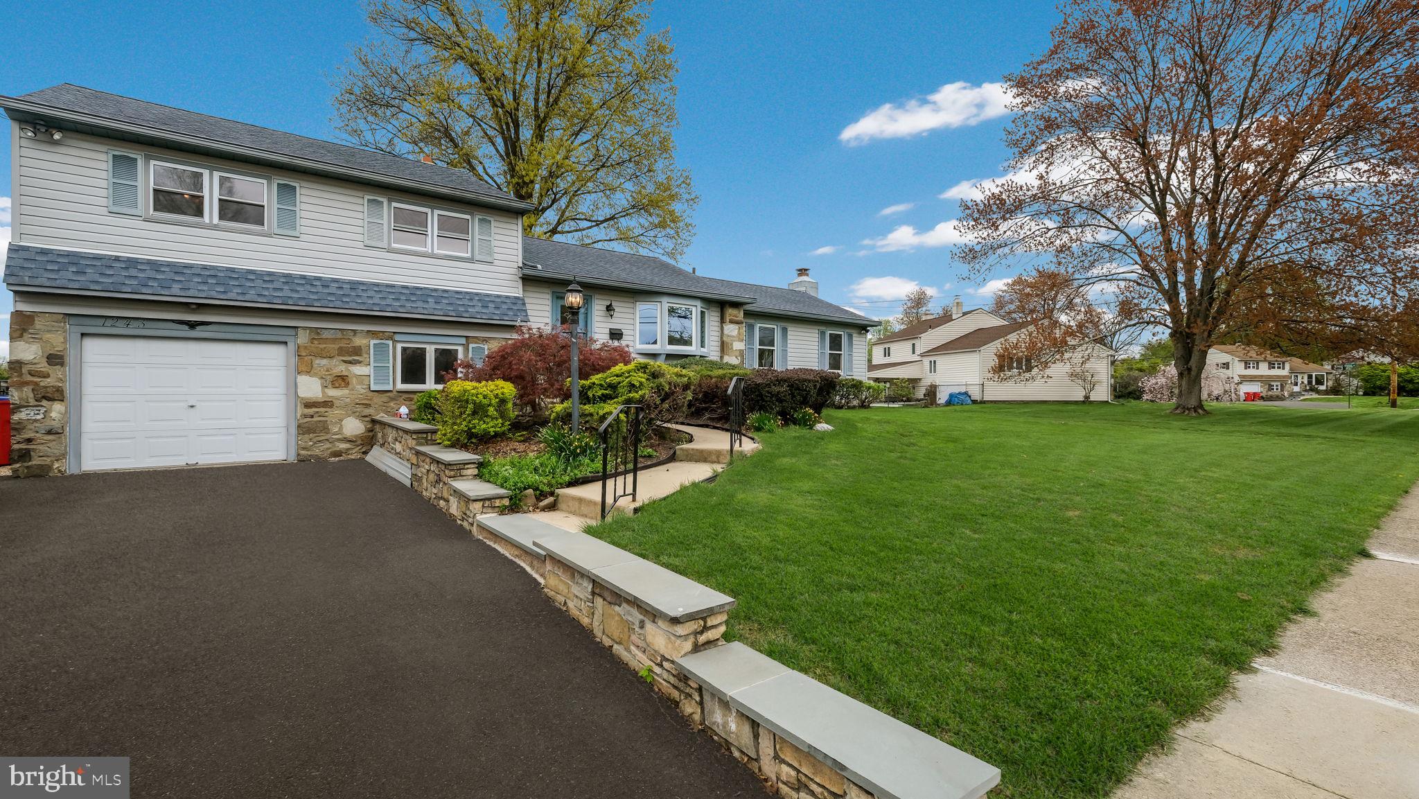 1243 Tulip Road Warminster, PA 18974 - Photo 2 of 33 a house view with a garden space