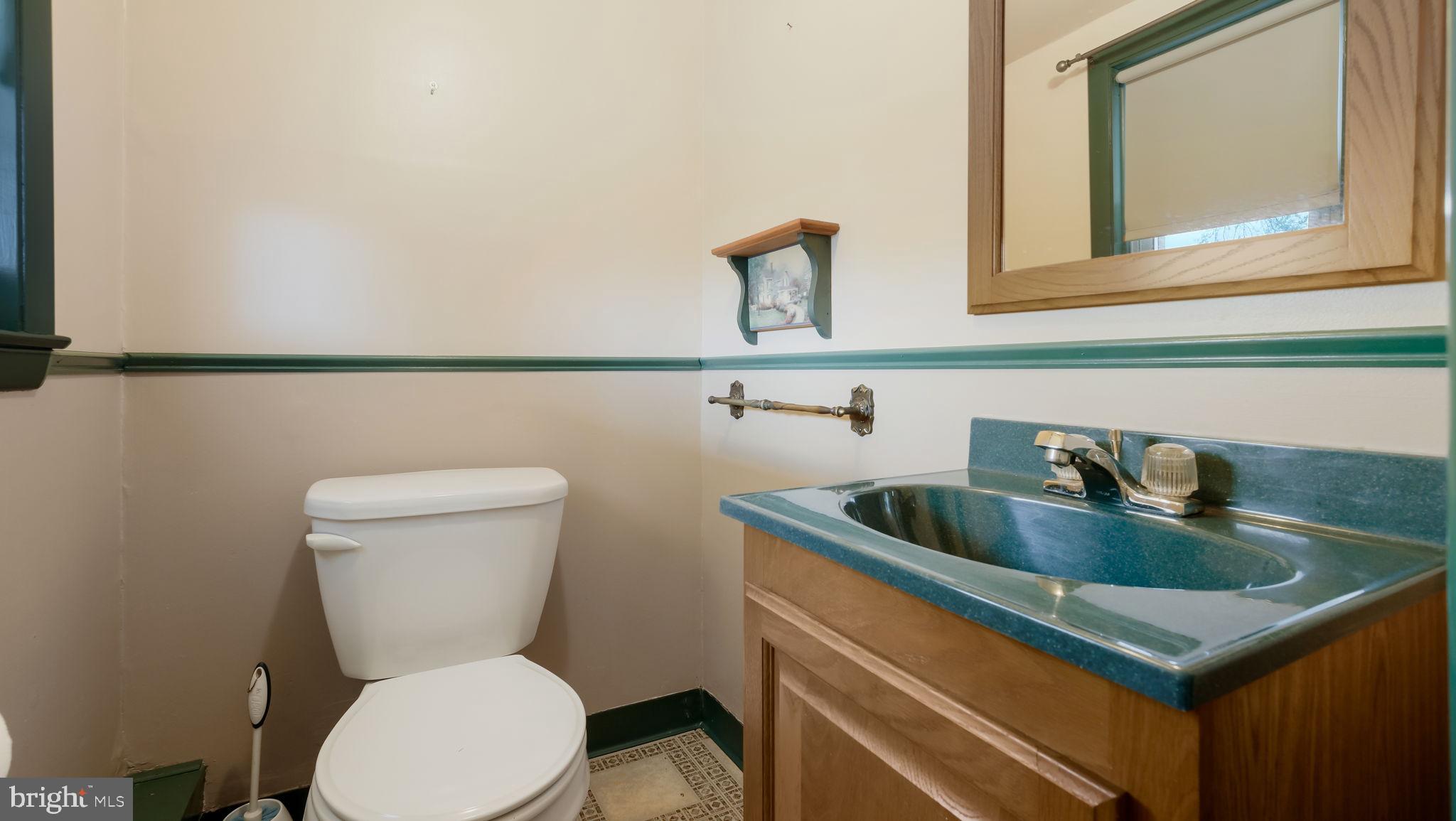 1243 Tulip Road Warminster, PA 18974 - Photo 21 of 33 a bathroom with a toilet sink and mirror