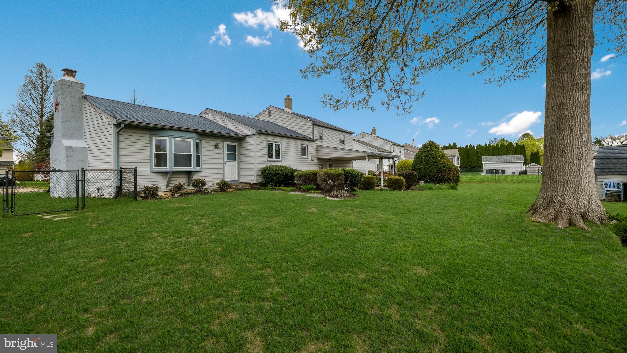 1243 Tulip Road Warminster, PA 18974 - Photo 29 of 33 a front view of a house with a garden and yard