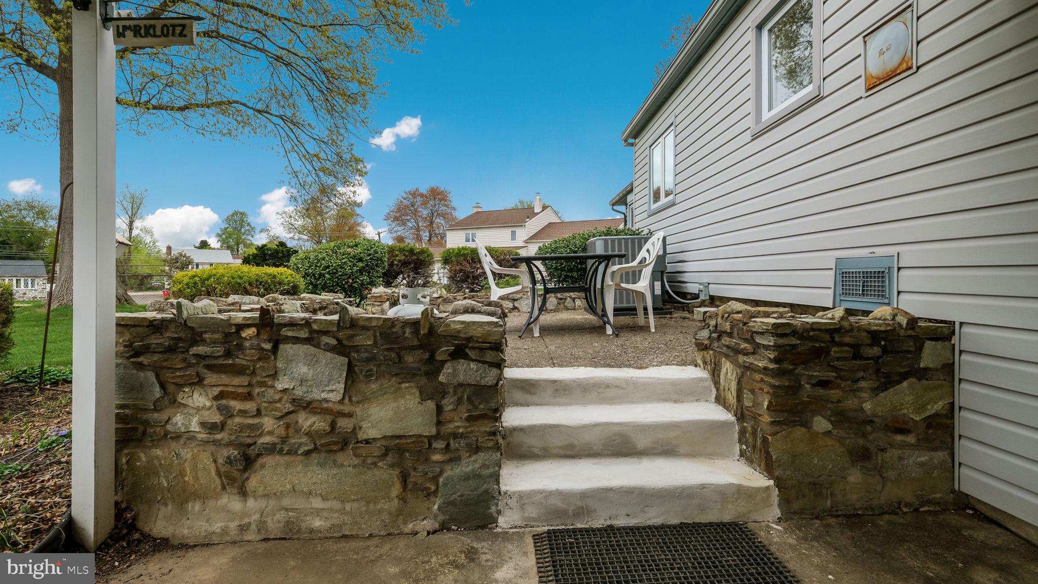 1243 Tulip Road Warminster, PA 18974 - Photo 30 of 33 a view of a patio with table and chairs and potted plants
