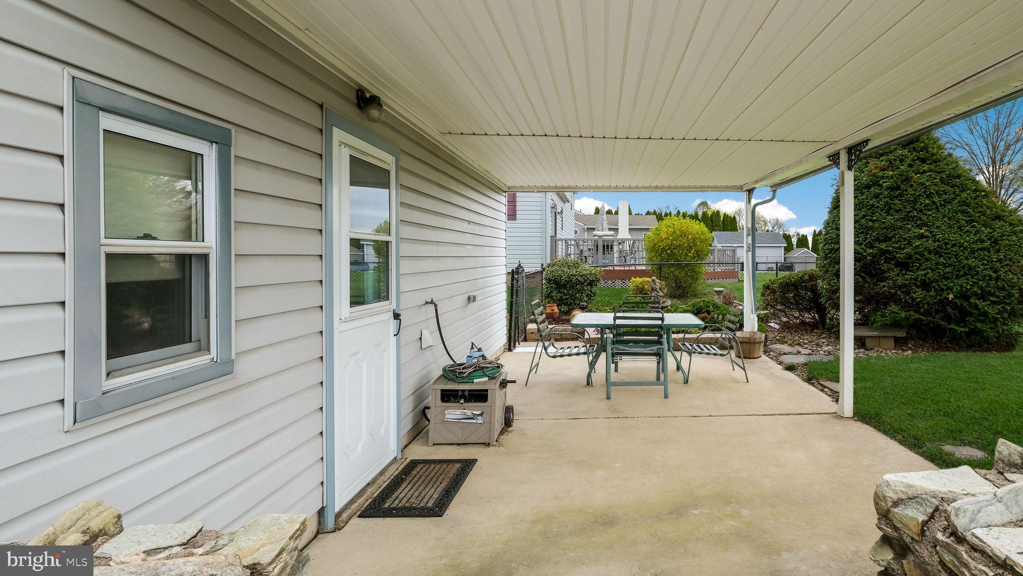 1243 Tulip Road Warminster, PA 18974 - Photo 32 of 33 a living room with patio furniture and garden