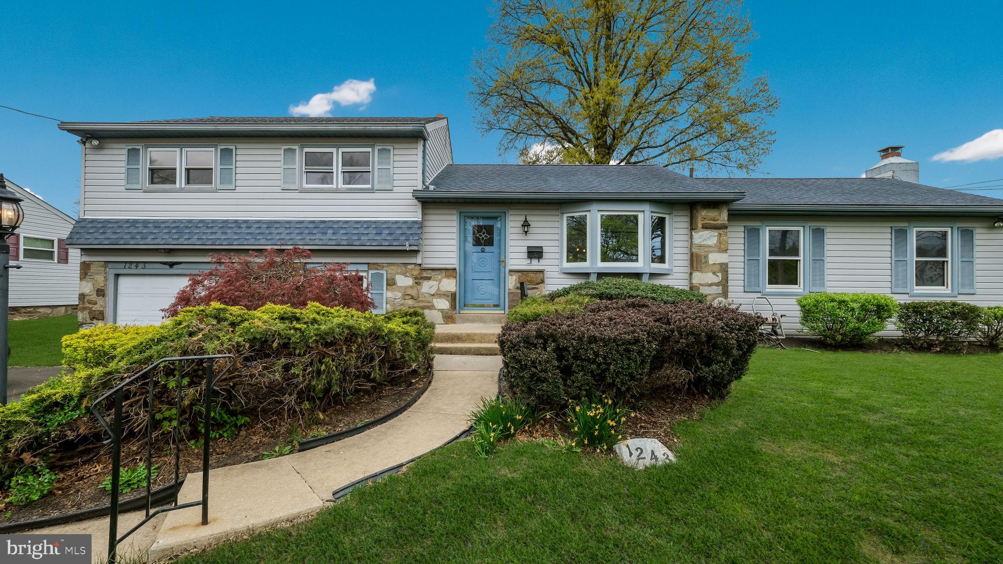 1243 Tulip Road Warminster, PA 18974 - Photo 4 of 33 a front view of a house with a garden