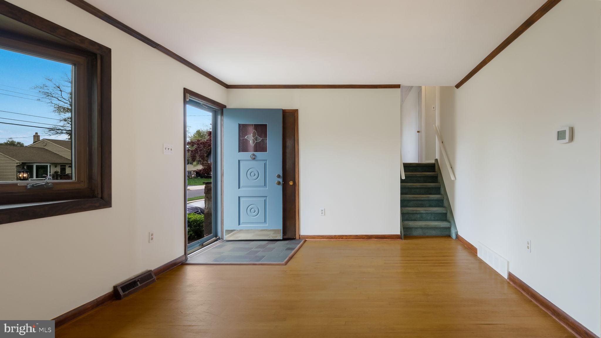 1243 Tulip Road Warminster, PA 18974 - Photo 5 of 33 an empty room with wooden floor and windows