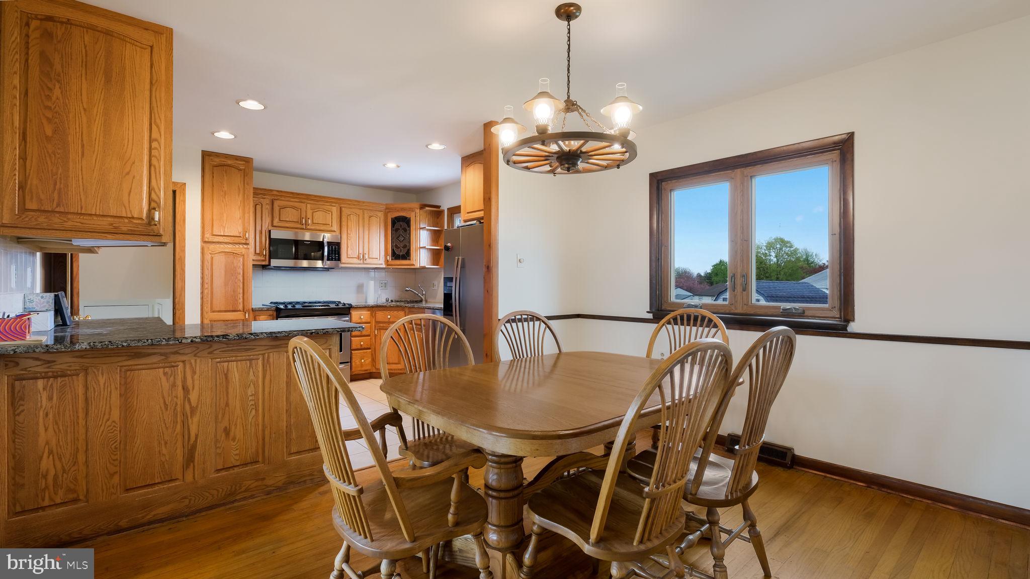 1243 Tulip Road Warminster, PA 18974 - Photo 9 of 33 a view of a dining room with furniture window and wooden floor