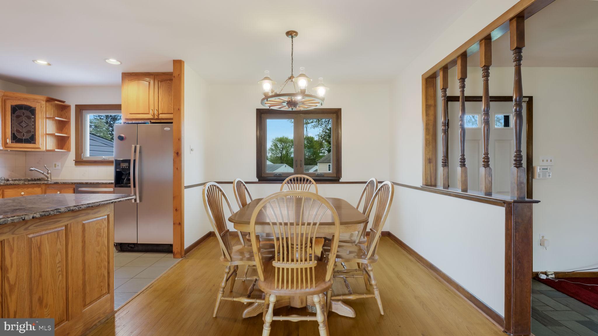 1243 Tulip Road Warminster, PA 18974 - Photo 10 of 33 a view of a dining room with furniture window and wooden floor