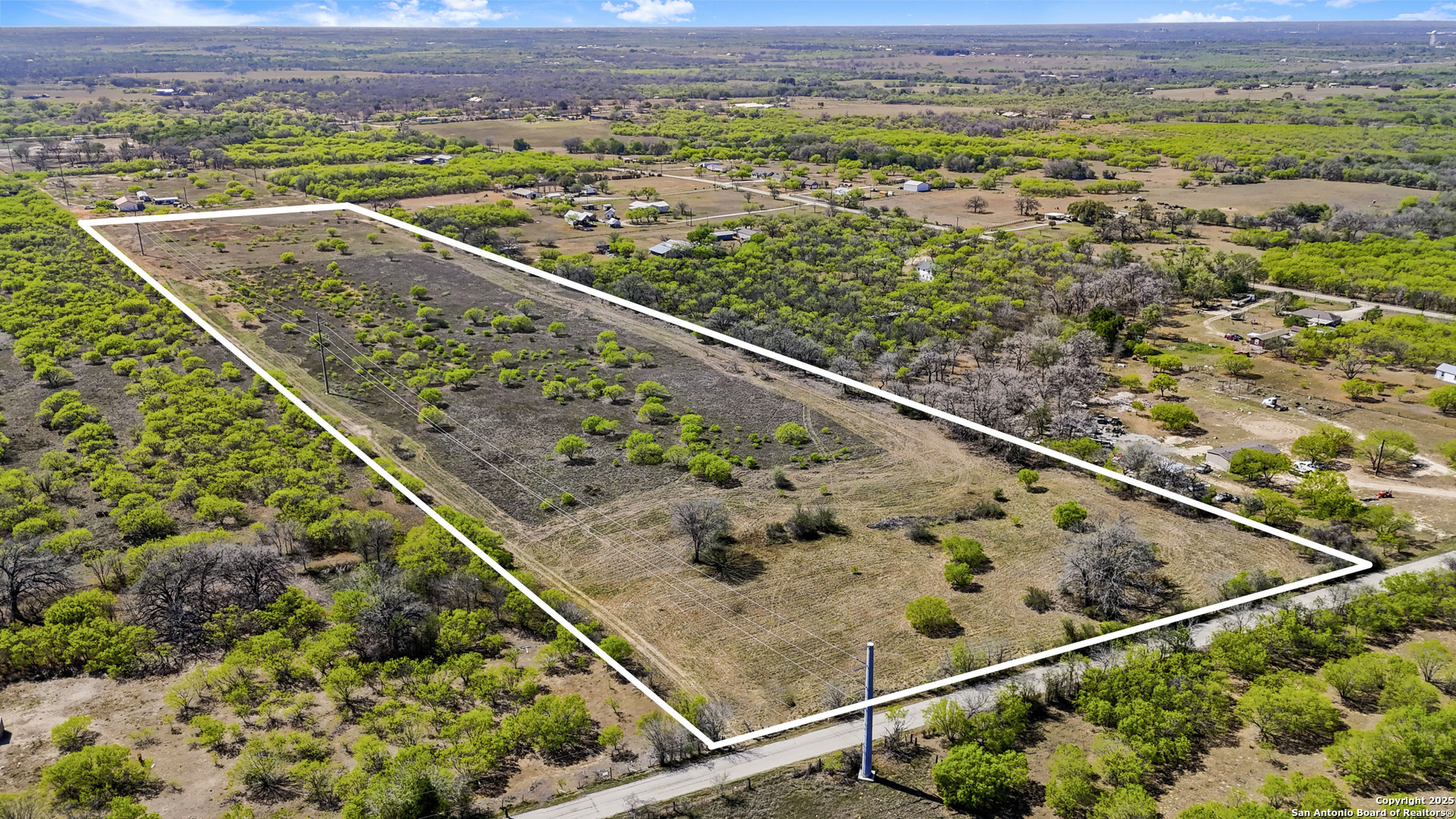 0 Fox Trotter Road Seguin, TX 78155 - Photo 12 of 12 a view of a city from a balcony with a couple of flower plants
