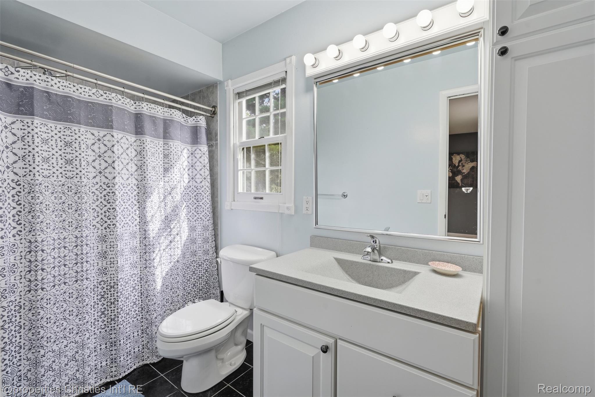 4030 Textile Road Ypsilanti, MI 48197 - Photo 23 of 58 White vanity with integrated sink and chrome faucet