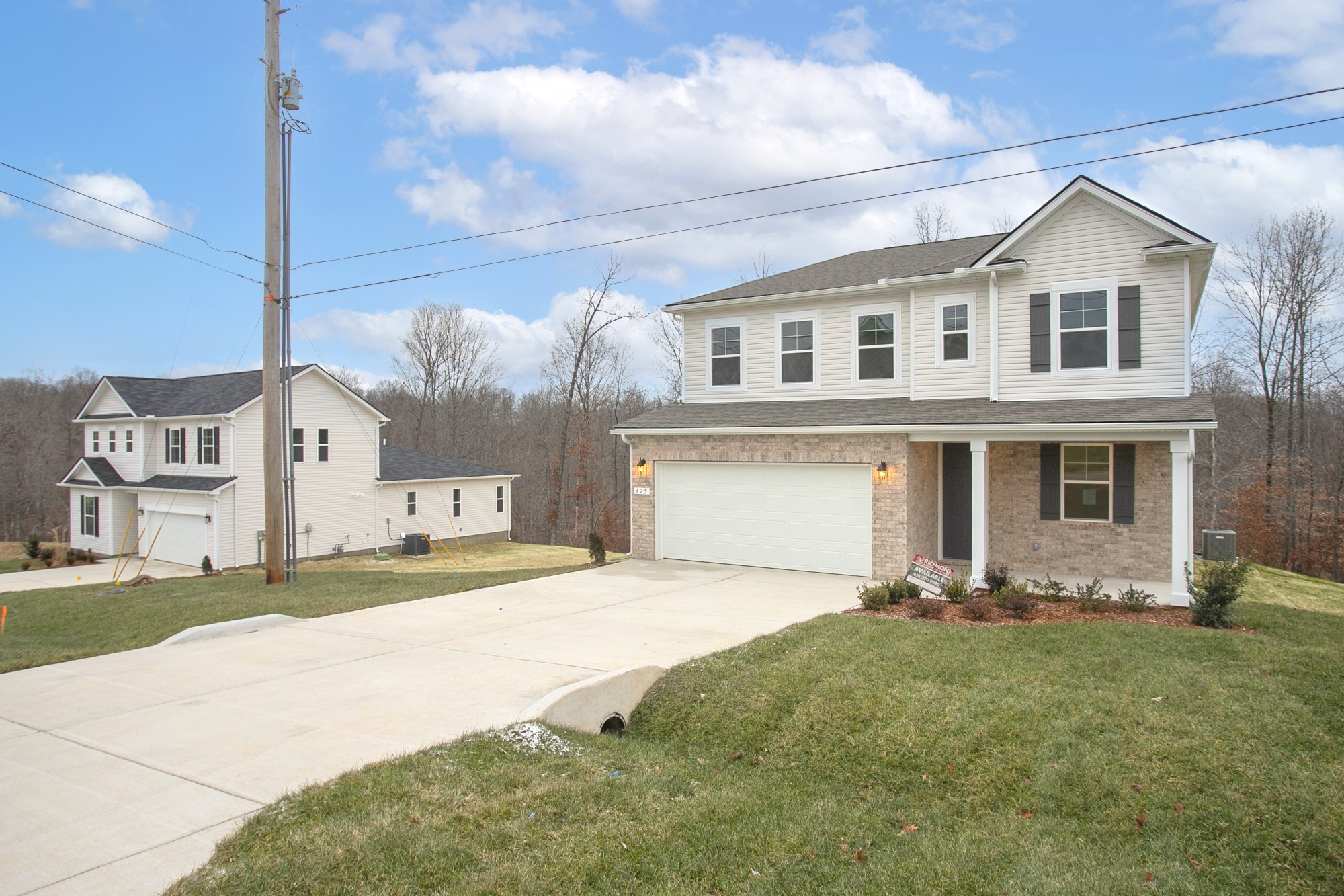 625 Maple Bend Dickson, TN 37055 - Photo 1 of 45 a front view of a house with a yard and garage