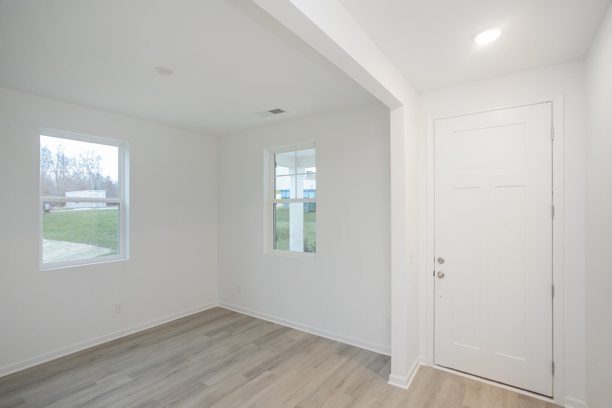 625 Maple Bend Dickson, TN 37055 - Photo 14 of 45 an empty room with wooden floor mirror and windows
