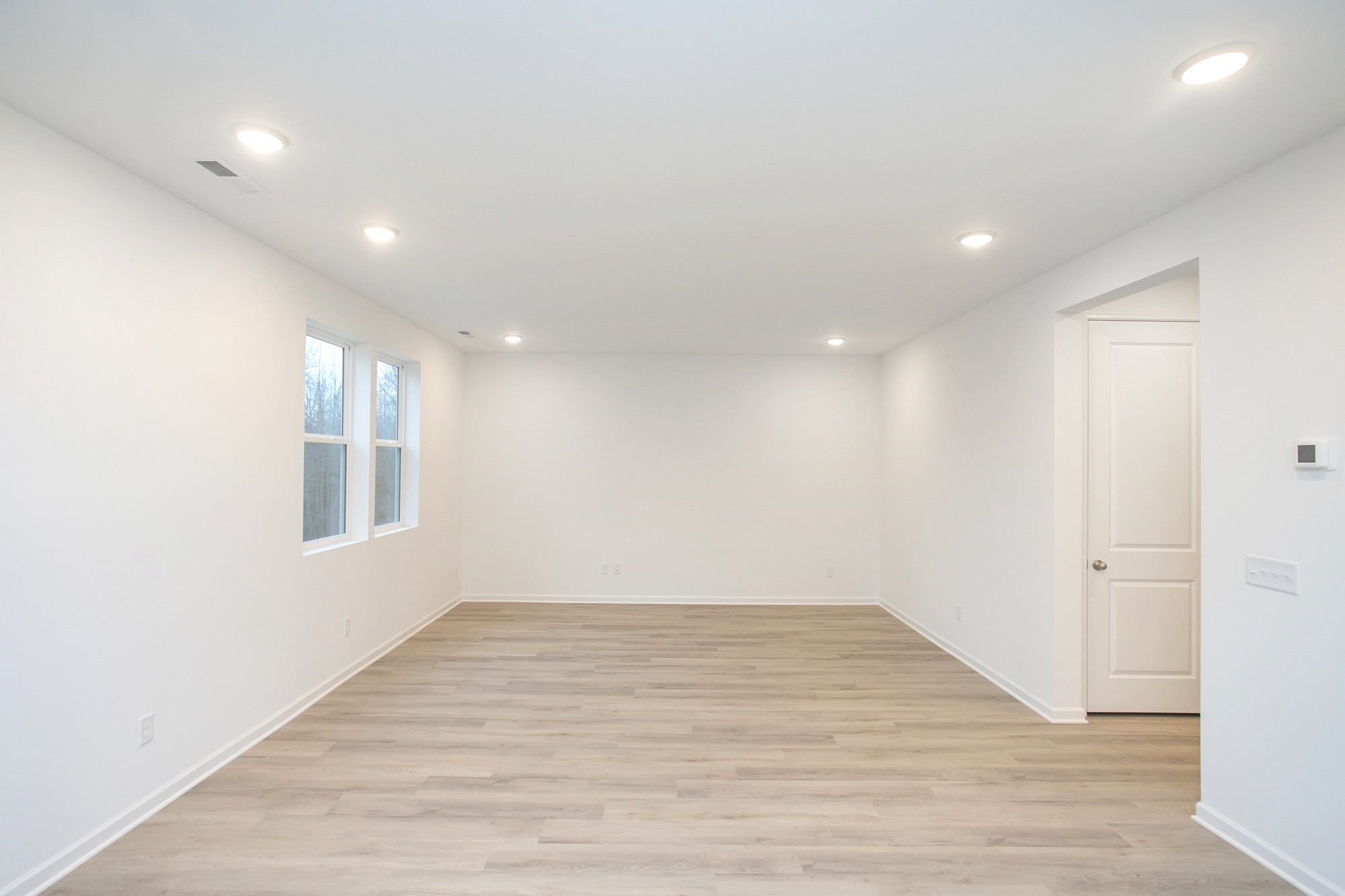 625 Maple Bend Dickson, TN 37055 - Photo 18 of 45 an empty room with wooden floor and windows