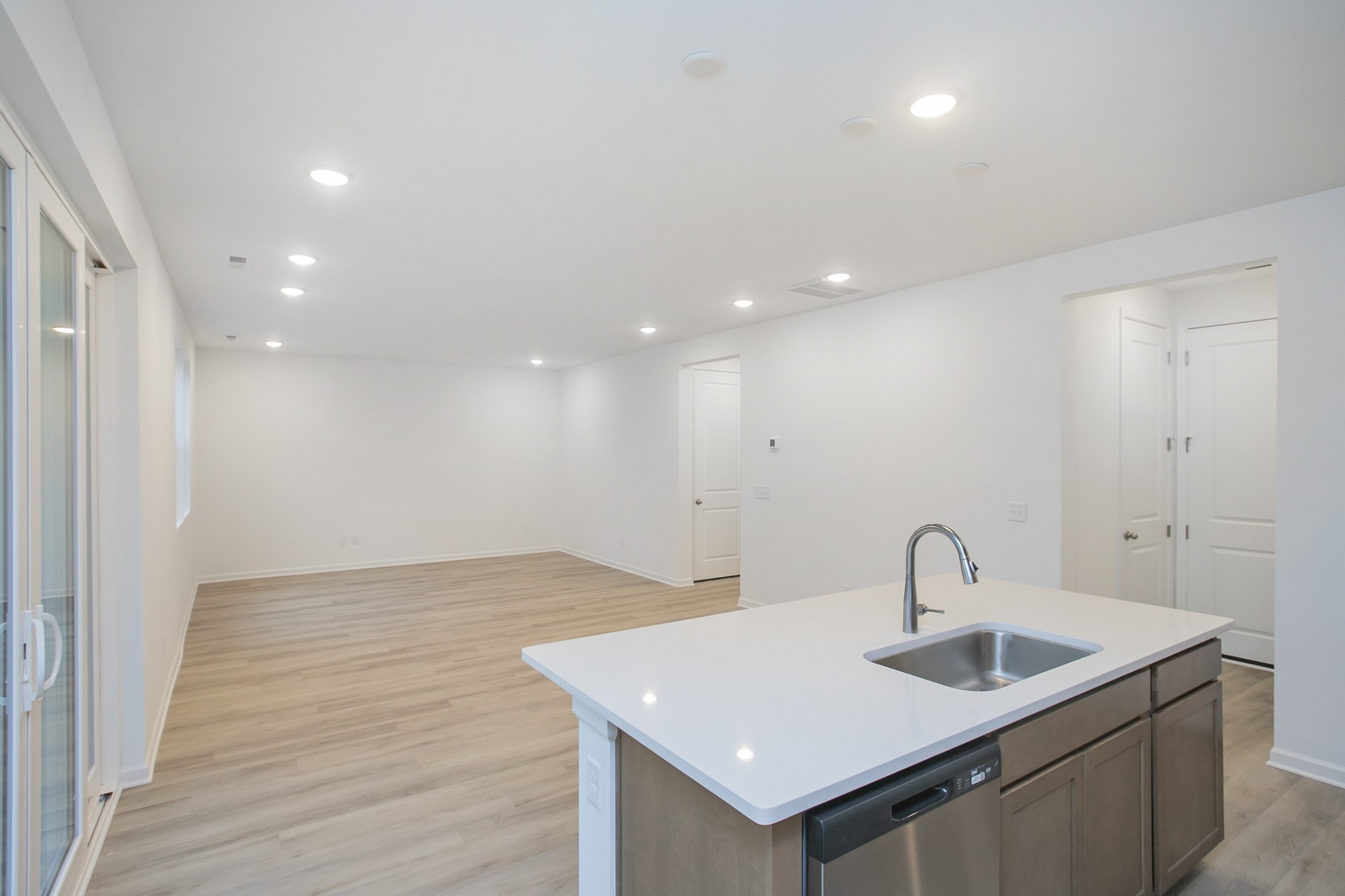 625 Maple Bend Dickson, TN 37055 - Photo 23 of 45 a kitchen with a sink and dishwasher with wooden floor