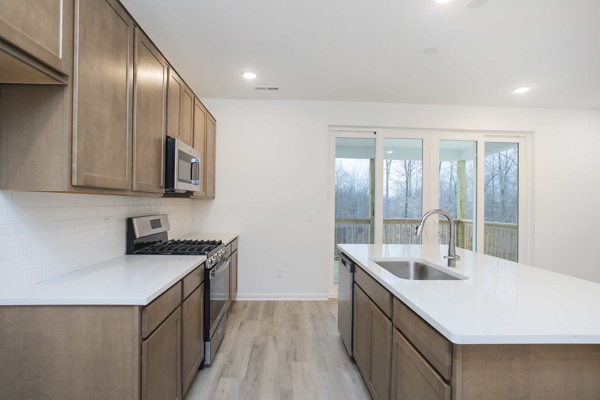 625 Maple Bend Dickson, TN 37055 - Photo 25 of 45 a kitchen with a sink stove and cabinets