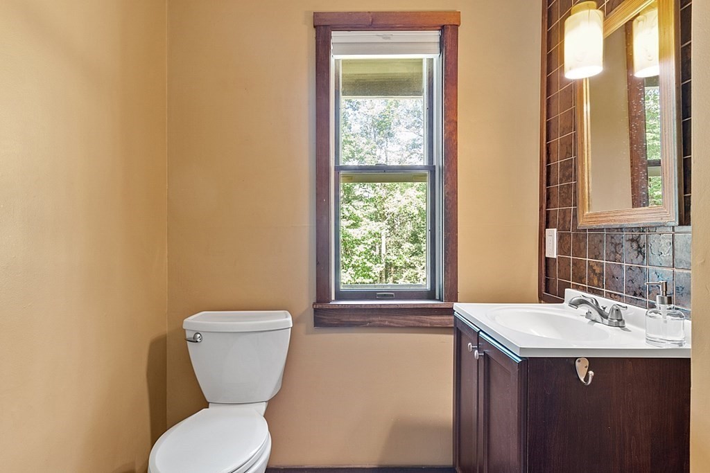 90 Minott Road Westminster, MA 01473 - Photo 17 of 41 a bathroom with a toilet sink and mirror