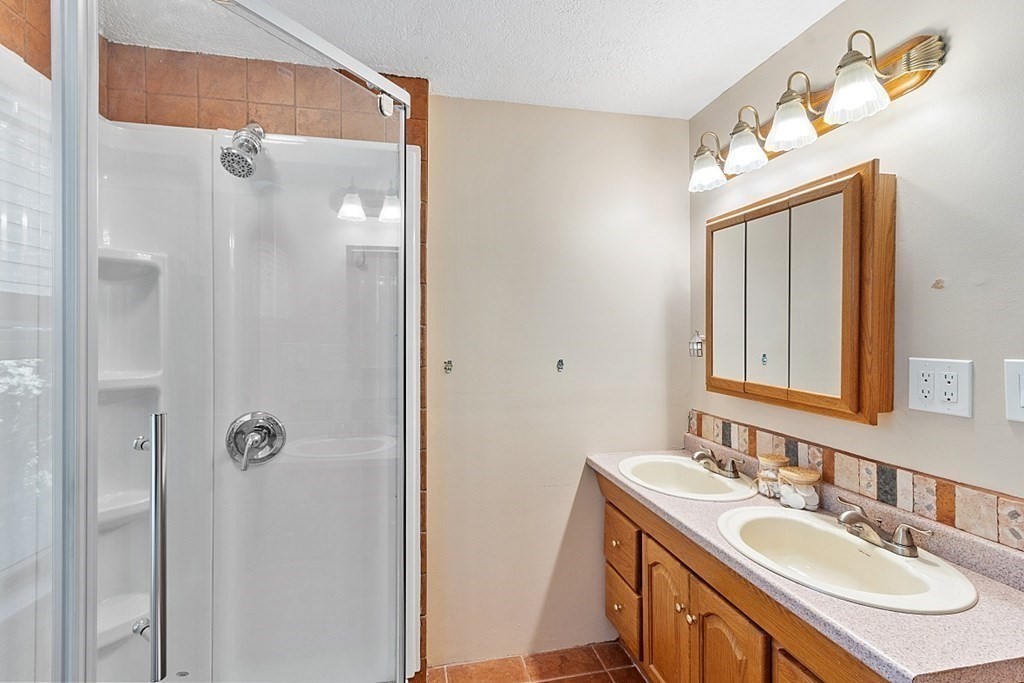 90 Minott Road Westminster, MA 01473 - Photo 23 of 41 a bathroom with a sink vanity and a mirror