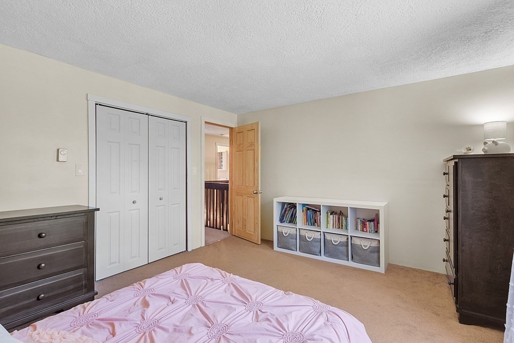 90 Minott Road Westminster, MA 01473 - Photo 25 of 41 a bedroom with a bed and a cabinet