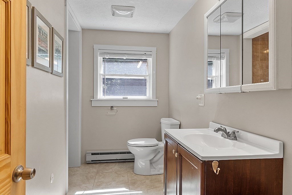 90 Minott Road Westminster, MA 01473 - Photo 27 of 41 a bathroom with a toilet sink and mirror