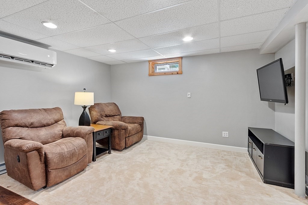 90 Minott Road Westminster, MA 01473 - Photo 33 of 41 a living room with furniture and a flat screen tv