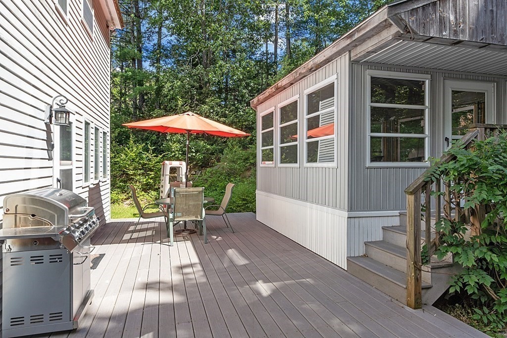 90 Minott Road Westminster, MA 01473 - Photo 36 of 41 a view of a house with a patio and a yard