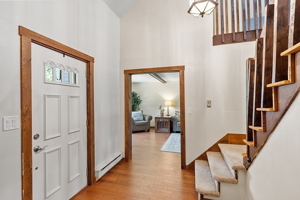 90 Minott Road Westminster, MA 01473 - Photo 9 of 41 a view of an entryway with wooden floor and a livingroom